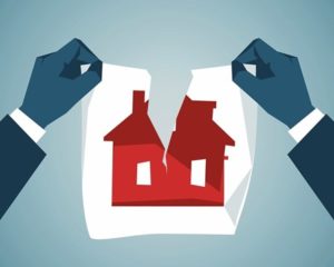 A home shown on paper being torn in half